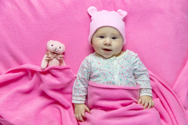 Baby sleeps with a bear. Selective focus. people.