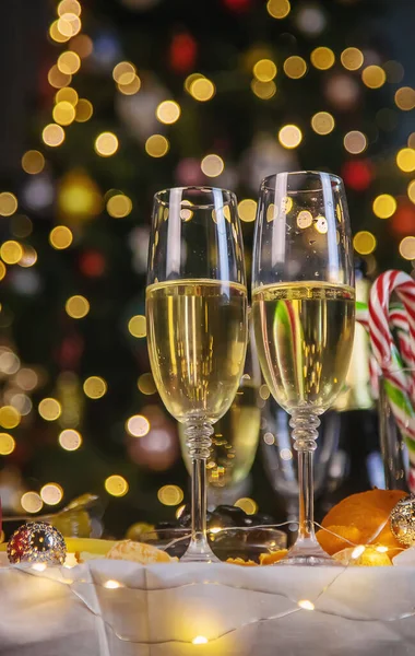 Christmas table with champagne and food. Selective focus. Holiday.