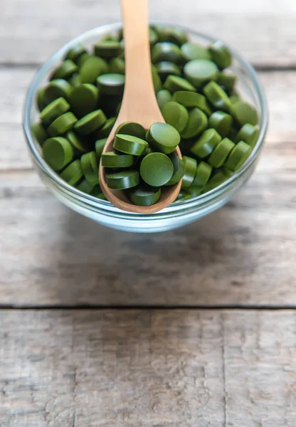 There are many spirulina and chlorella tablets. Selective focus. nature.
