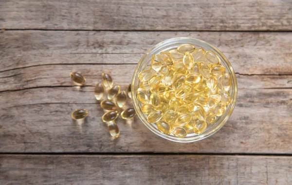 Yağ çözünür kapsüllerde E vitamini. Seçici odaklanma. yiyecek.