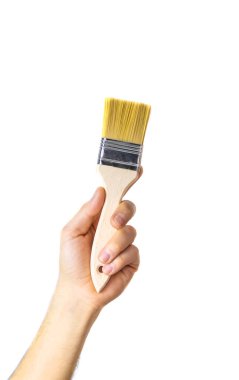 Erkek izolasyonun ellerinde tamir fırçası. Seçici odaklanma. İnsanlar.