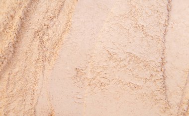 Yüz pudrası için kozmetik doku. Seçici odaklanma. Bej.