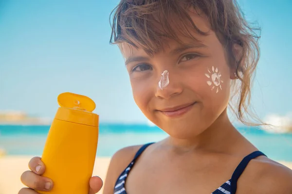 Sunscreen on the skin of a child. Selective focus. nature.