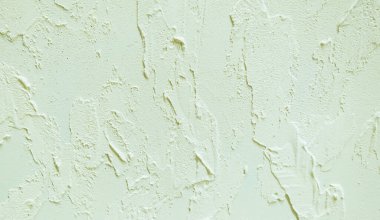 Duvarda dekoratif macun örneği var. Ev tamiri. Seçici odaklanma. Renk.