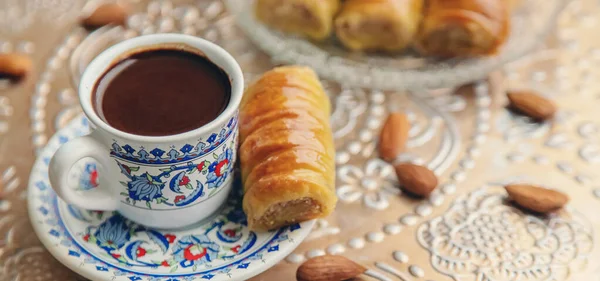 A cup of Turkish coffee and baklava. Selective focus. drink.