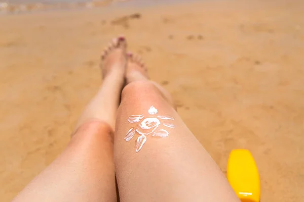Woman Smears Her Feet Sunscreen Selective Focus People — Stock Photo, Image