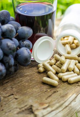 Resveratrol supplements and homeopathy. Selective focus. food.