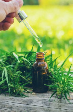 Cannabis supplements and homeopathy. Selective focus. Nature.