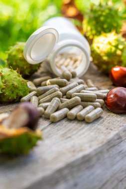Horse chestnut tincture and supplements. Selective focus. Nature.