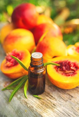 Peach kernel oil and supplements. Selective focus. nature.