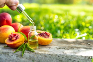 Peach kernel oil and supplements. Selective focus. nature.