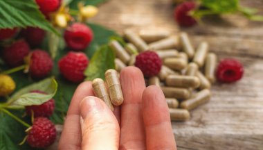 Raspberry leaf extract and supplements. Selective focus. Food.