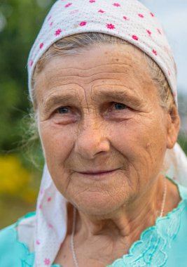 Beautiful portrait of an old woman. Selective focus. People.