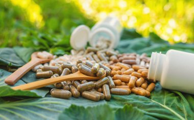 Various herbal supplement capsules. Selective focus. nature.