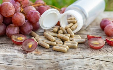 Grape seed extract in the garden. Selective focus. nature.