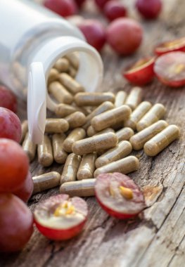 Grape seed extract in the garden. Selective focus. nature.