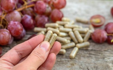 Grape seed extract in the garden. Selective focus. nature.