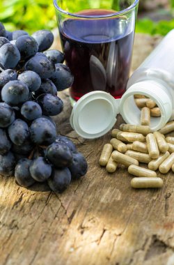 Resveratrol supplements and homeopathy. Selective focus. food.