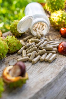 Horse chestnut tincture and supplements. Selective focus. Nature.