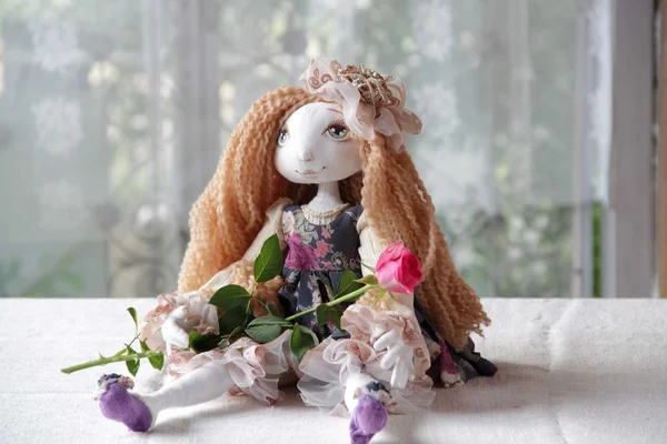 Doll with long hair and a rose — Stock Photo, Image