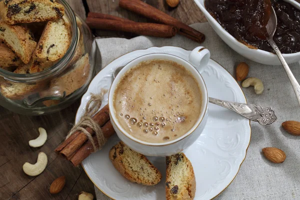 Coffee with milk and sugar served with biscuits — Stock Photo, Image