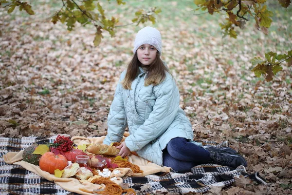 Girl in the autumn park on a picnic