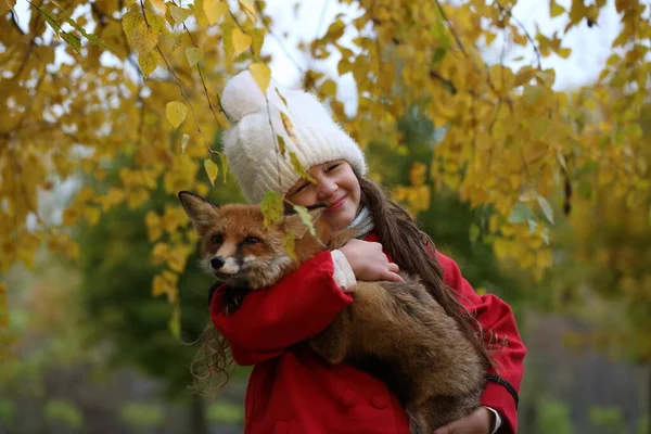 Girl Red Coat Holding Fox — Stock Photo, Image