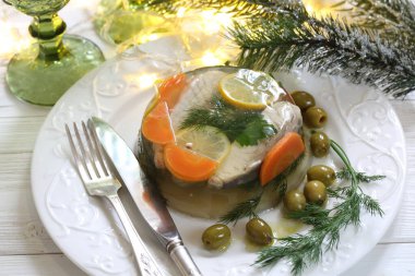 Still life with jellied sturgeon with lemon and olives clipart