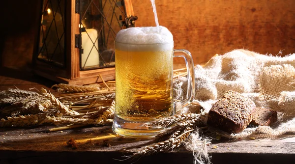 Beer in a transparent mug — Stock Photo, Image