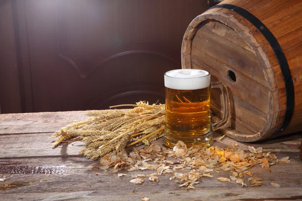 Beer with foam in a transparent mug — Stock Photo, Image