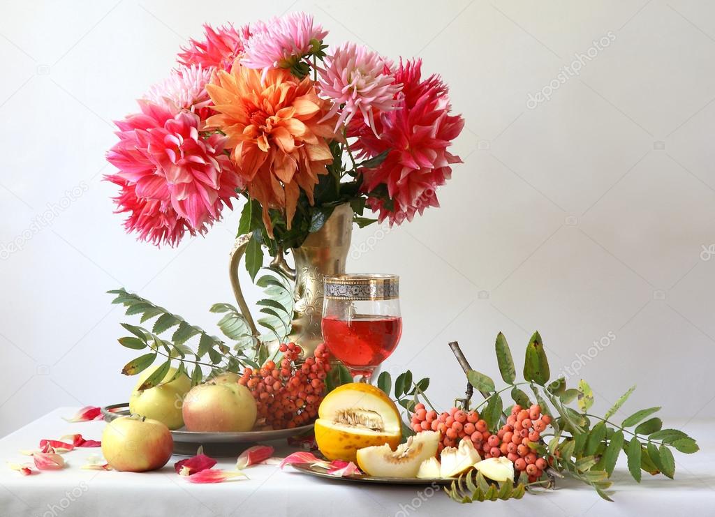 Still-life with wine, a melon, apples and a bouquet a dahlia