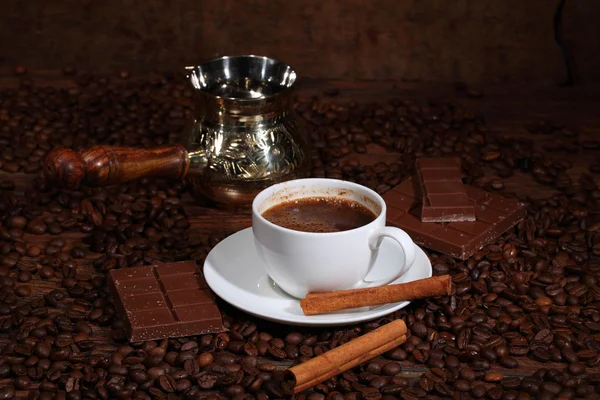 Still-life from coffee, chocolate, cinnamon and tourist's which — Stock Photo, Image