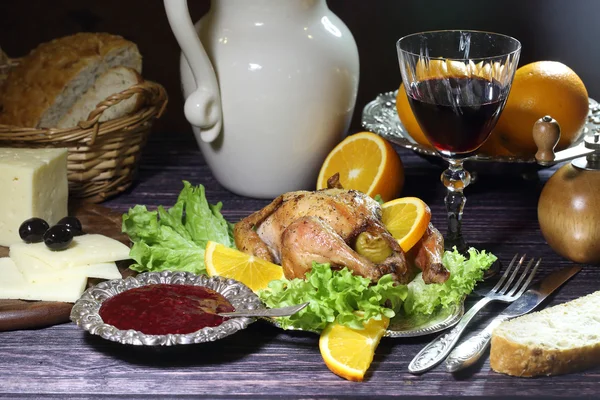 Chicken - kornishony and a red wine glass — Stock Photo, Image