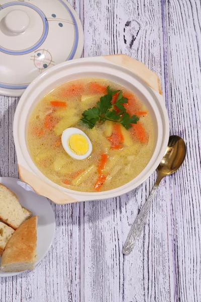 Chicken soup with house noodles and boiled egg — Stock Photo, Image