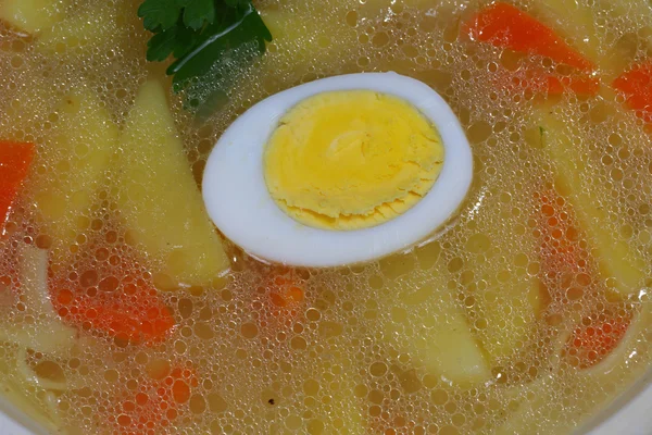 Chicken soup with house noodles and boiled egg — Stock Photo, Image