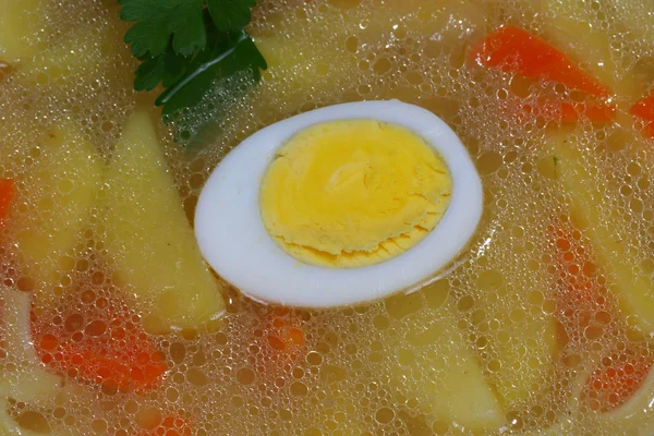 Chicken soup with house noodles and boiled egg — Stock Photo, Image