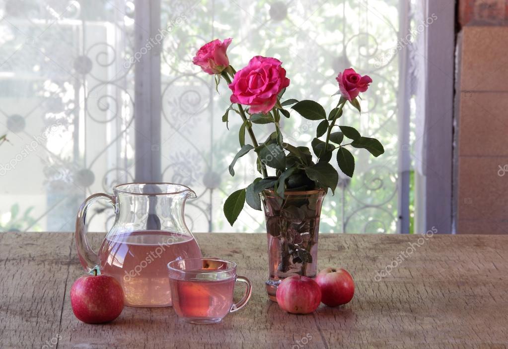 Compote from apples in a transparent jug  