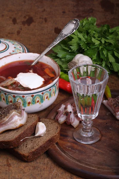 Borsch submitted with vodka and salty fat — Stock Image Borsch submitted with vodka and salty fat Stock Picture
