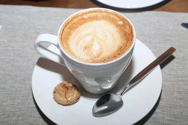 Cappuccino in a white cup — Stock Photo, Image