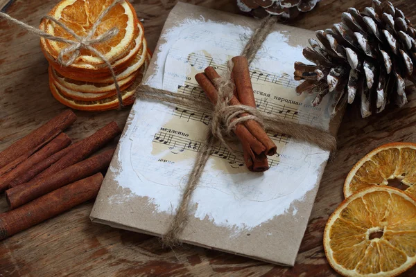 Still-life with cones, cinnamon and dried oranges — Stock Photo, Image