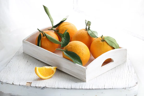 Oranges on a wooden tray — Stock Photo, Image