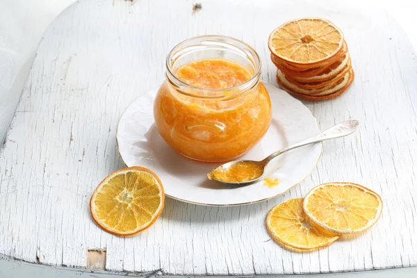 Orange confiture in a glass jar — Stock Photo, Image
