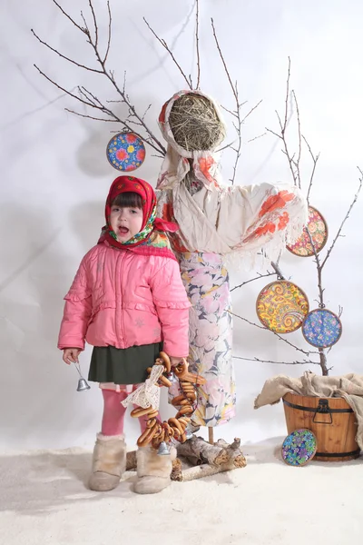 The girl with a hand bell at the Pancake week stuffed animal — Stock Photo, Image