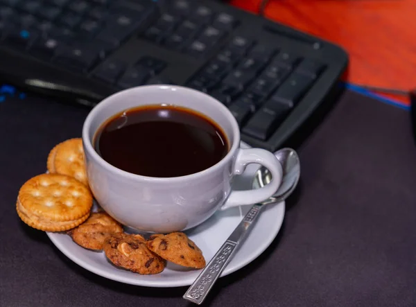 Afternoon favorite cup of coffee in front of the desk