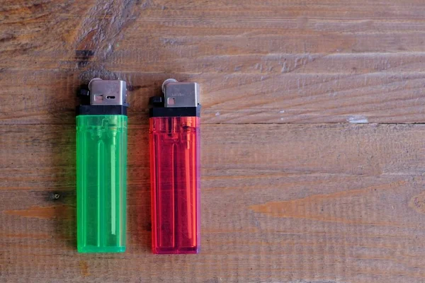 Gas-fired lighters with transparent red and green chasing