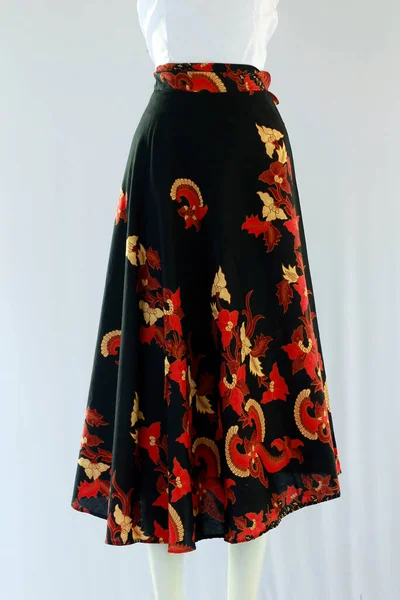 Casual women\'s skirt with a length to the calf with a batik floral motif looks beautiful.