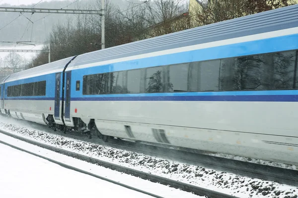 Czech train station at winter with train in a snowstorm — Stock Photo, Image