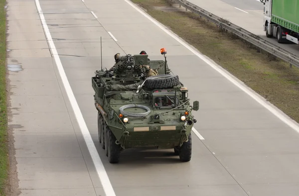 Stryker, wheeled armored vehicle drives on highway  . — стоковое фото