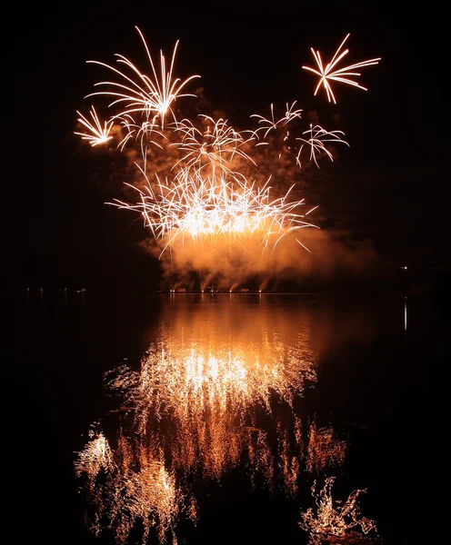 Colorful fireworks with reflection on lake. — Stock Photo, Image