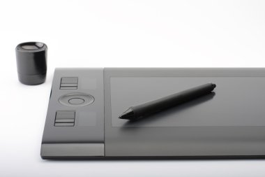 graphic tablet and pen and stand for nibs on white background